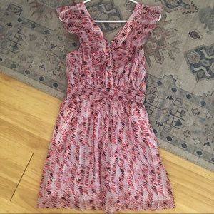 Pink ruffled shoulder mini dress.